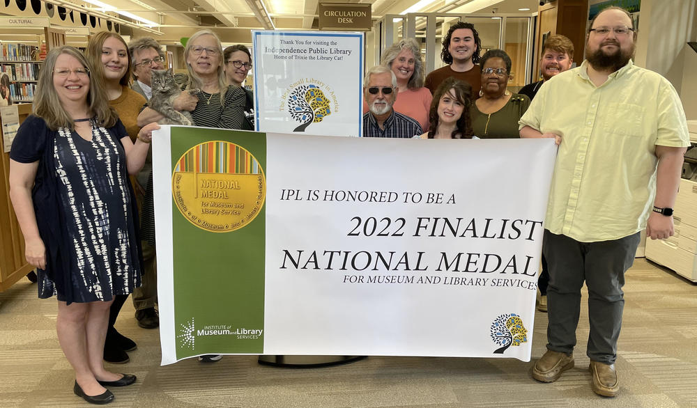 library staff with 2022 finalist banner